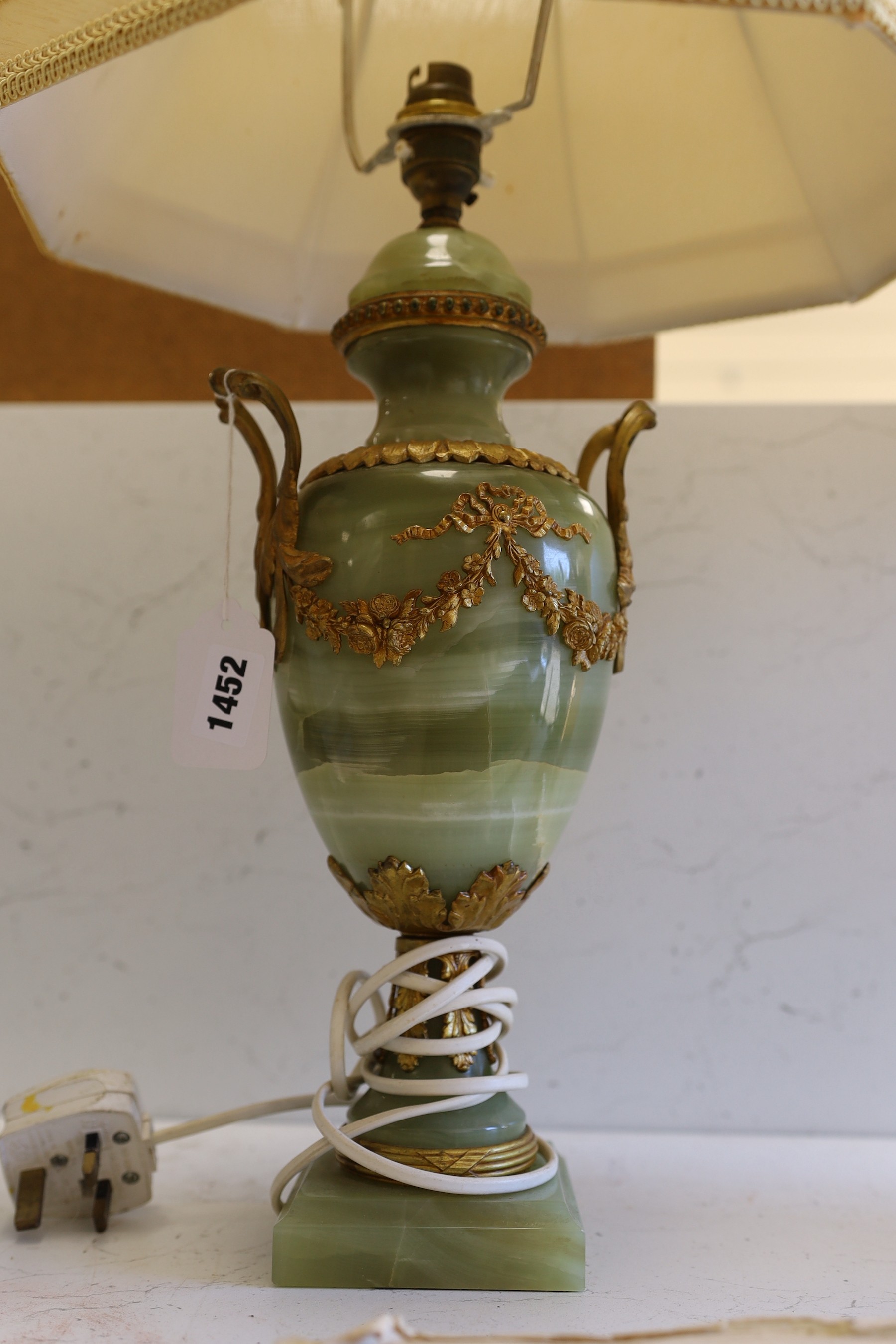 A pair of early 20th century brass mounted onyx urn shaped lamps, 35cm high not including light fitting or shade